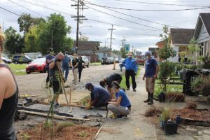 Volunteers install stormwater features along a block in the 7th Ward, New Orleans
